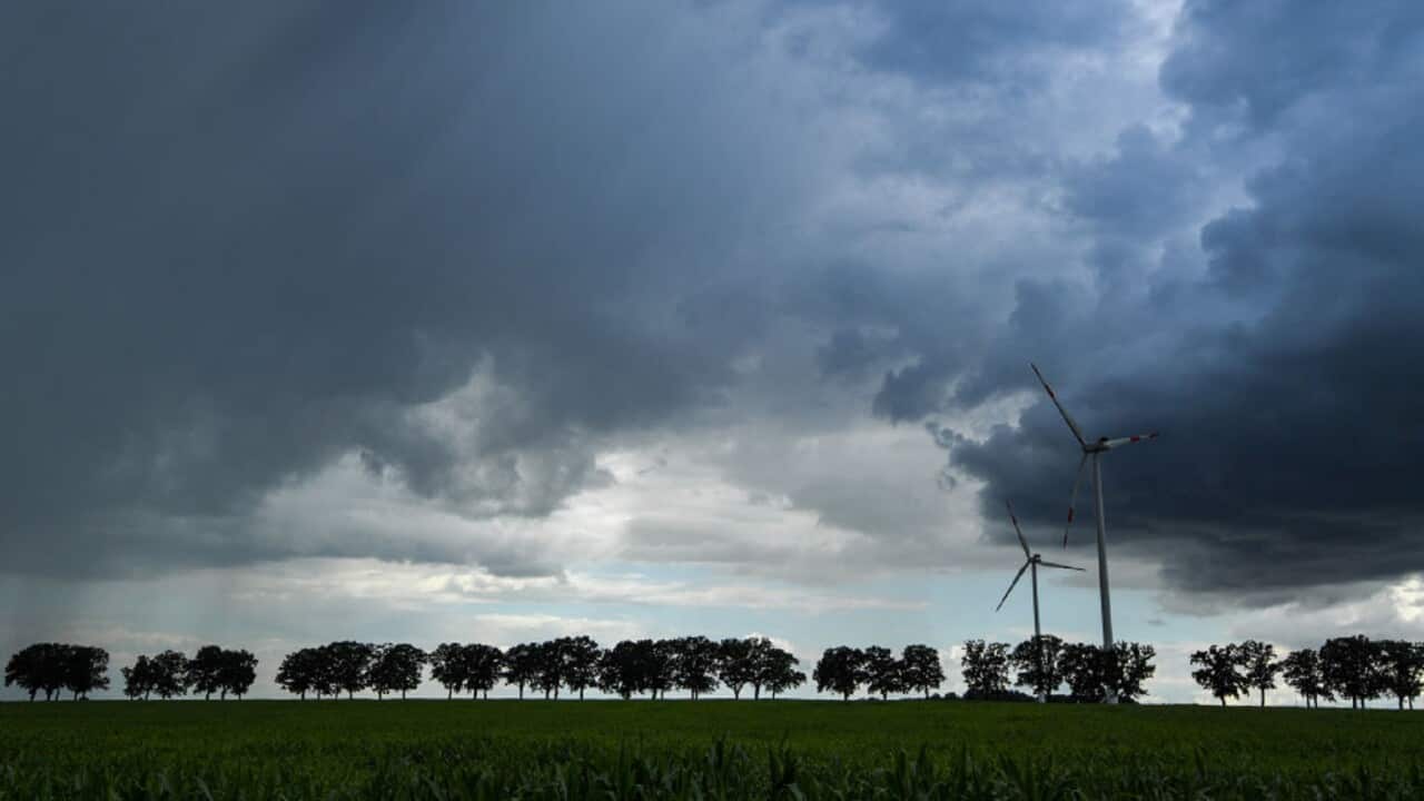 A stormy sky and wind turbines