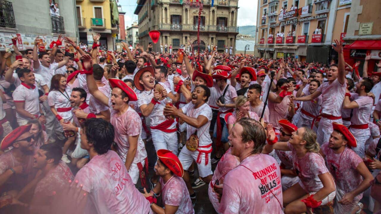 Revellers enjoy the atmosphere during the opening day or 'Chupinazo' of the San Fermin Running of the Bulls fiesta on July 6, 2018 in Pamplona, Spain.