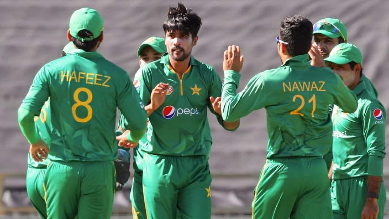 Mohammad Amir (centre) of Pakistan celebrates after dismissing Usman Khawaja of Australia