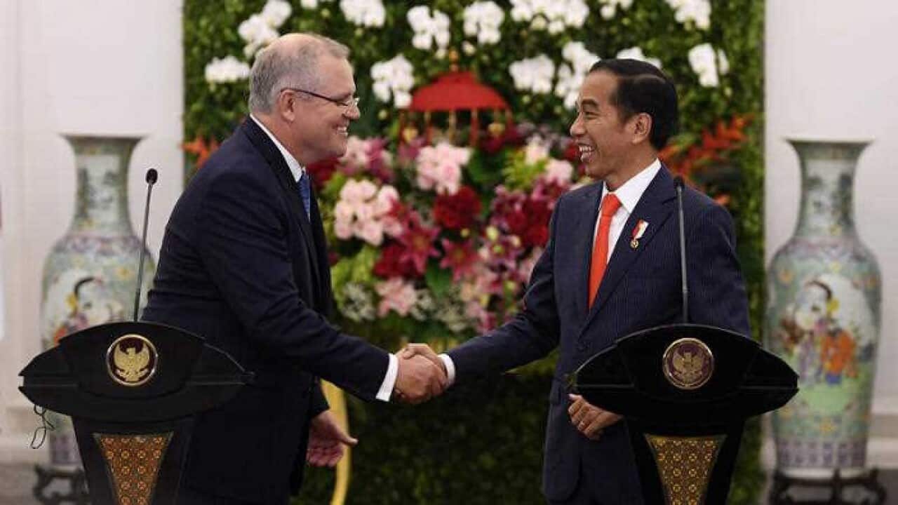 Australian Prime Minister Scott Morrison and Indonesian President Joko Widodo shake hands at Bogor Presidential Palace near Jakarta