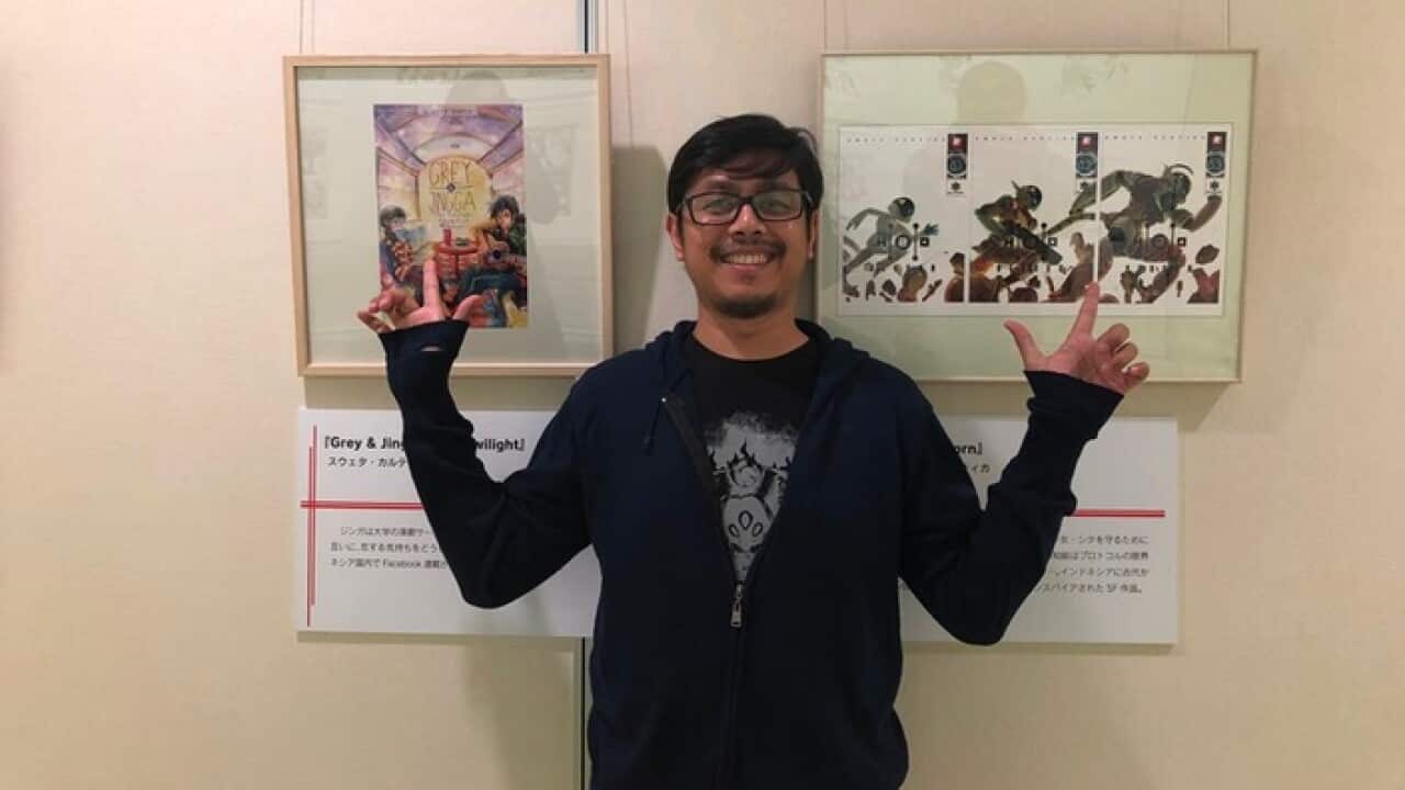Sweta Kartika with two of his works at the Kitakyushu International Manga Museum at Kitakyushu, Japan, when he was invited to represent Indonesia, 22 Dec 2018.