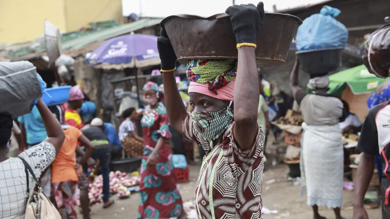 Lagos food markets reopen after a five-week lockdown in the Nigerian capital.