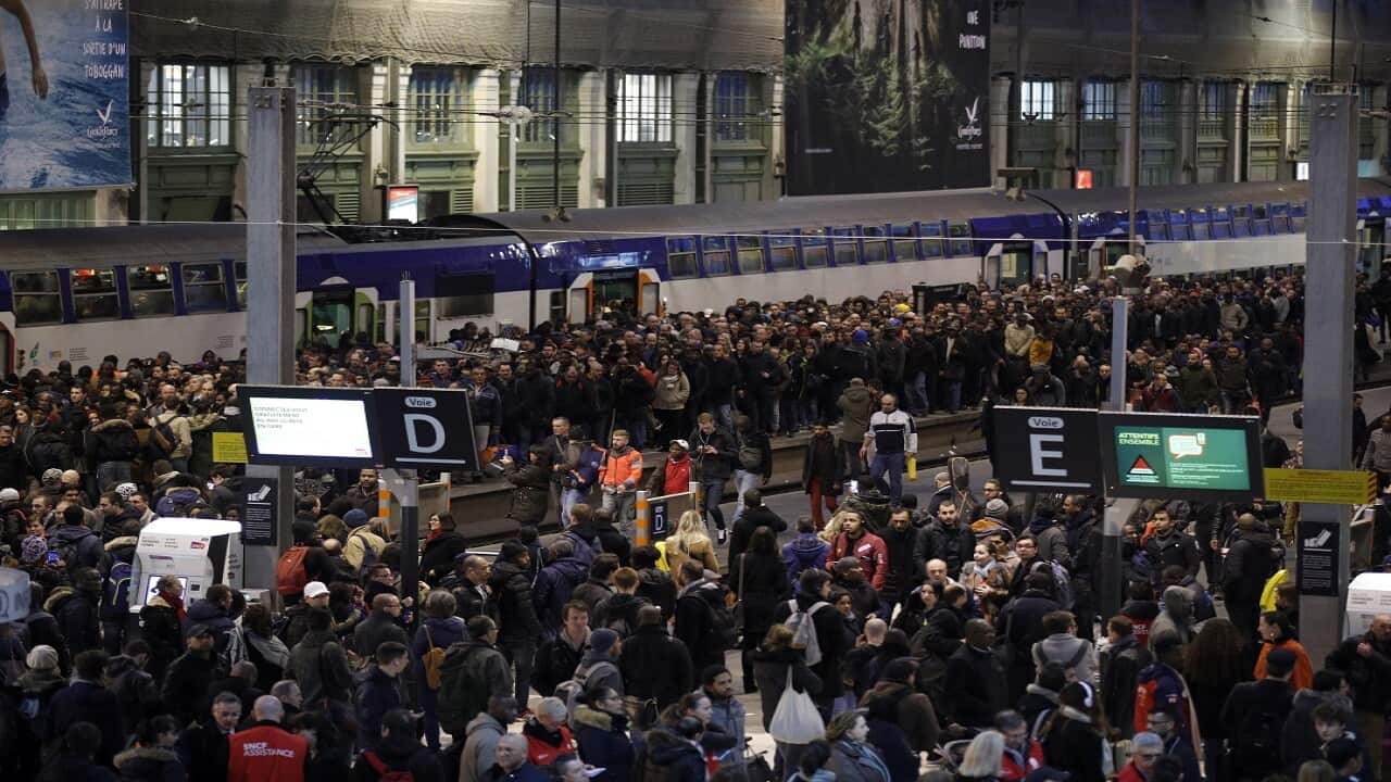 Commuters wait at rush hour at Gare de Lyon train station in Paris.