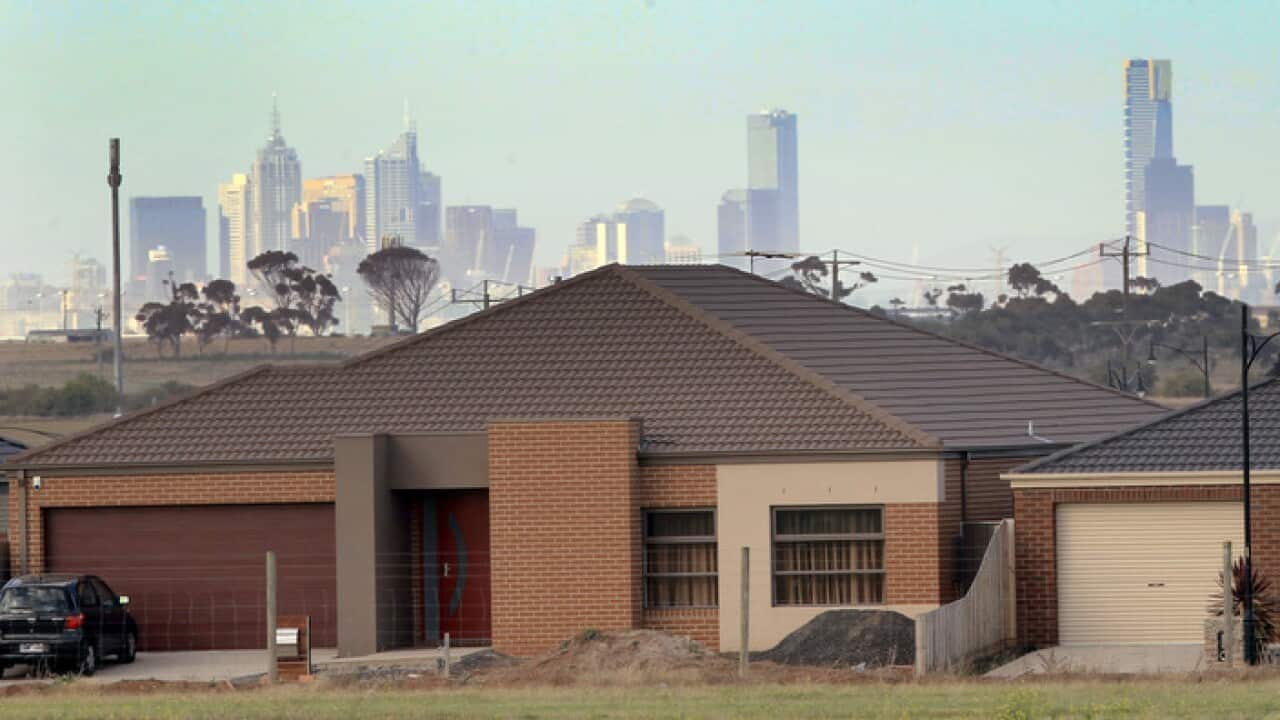 The Melbourne city skyline is seen behind a new home at a housing estate at Deer Park in the outer western suburbs of Melbourne, Wednesday, May 23, 2012. (AAP Image/David Crosling) NO ARCHIVING