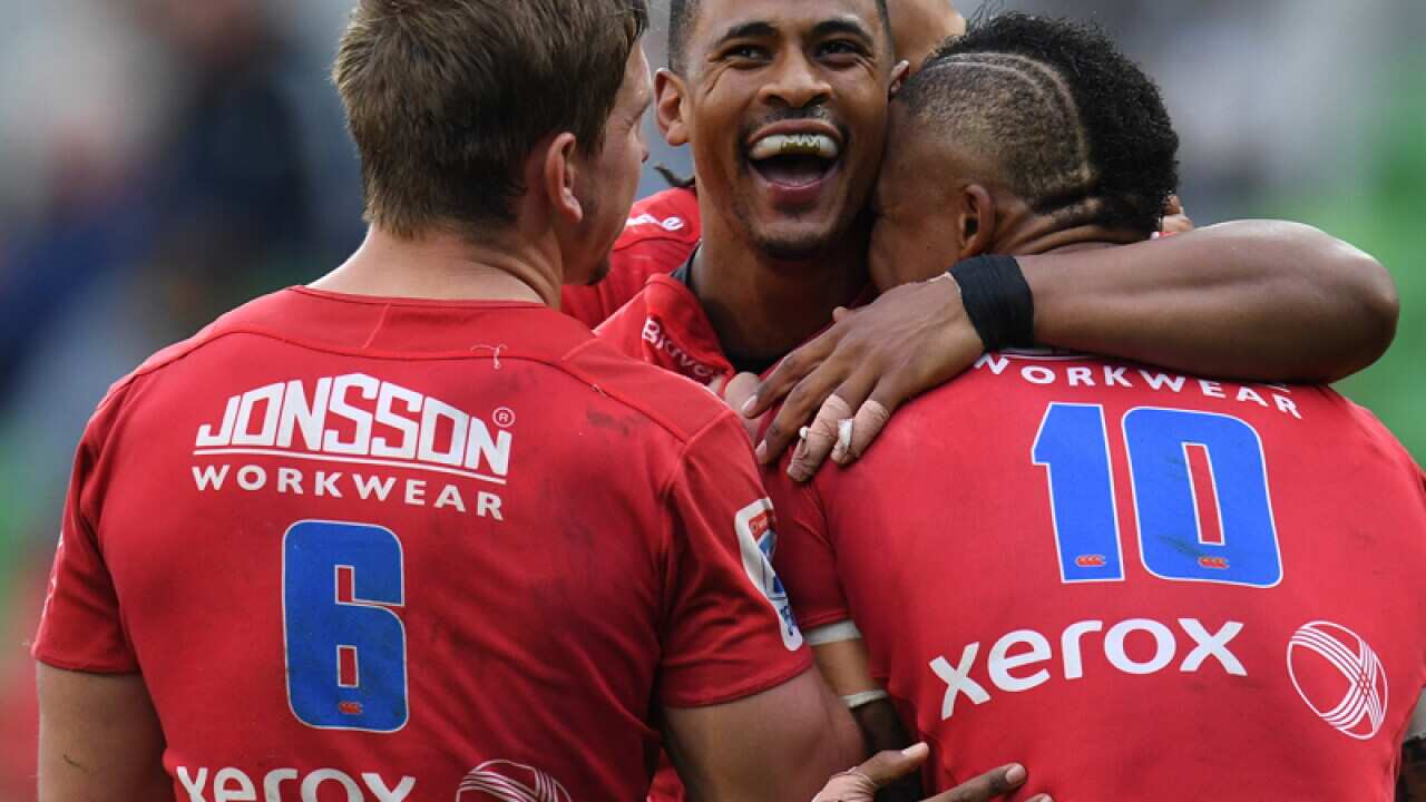 Lions players react after Anthony Volmink (centre) scored a try