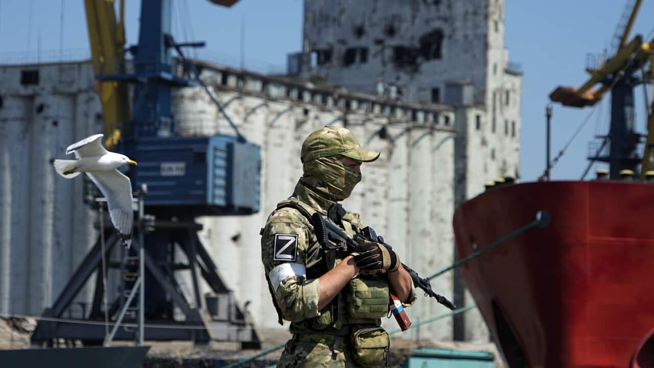 A soldier at a ship port