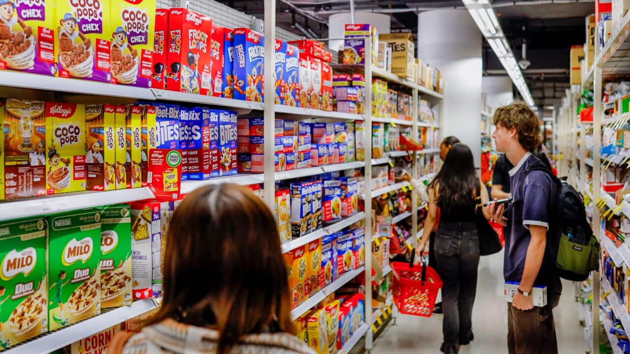 Shoppers are seen browsing at a Coles supermarket