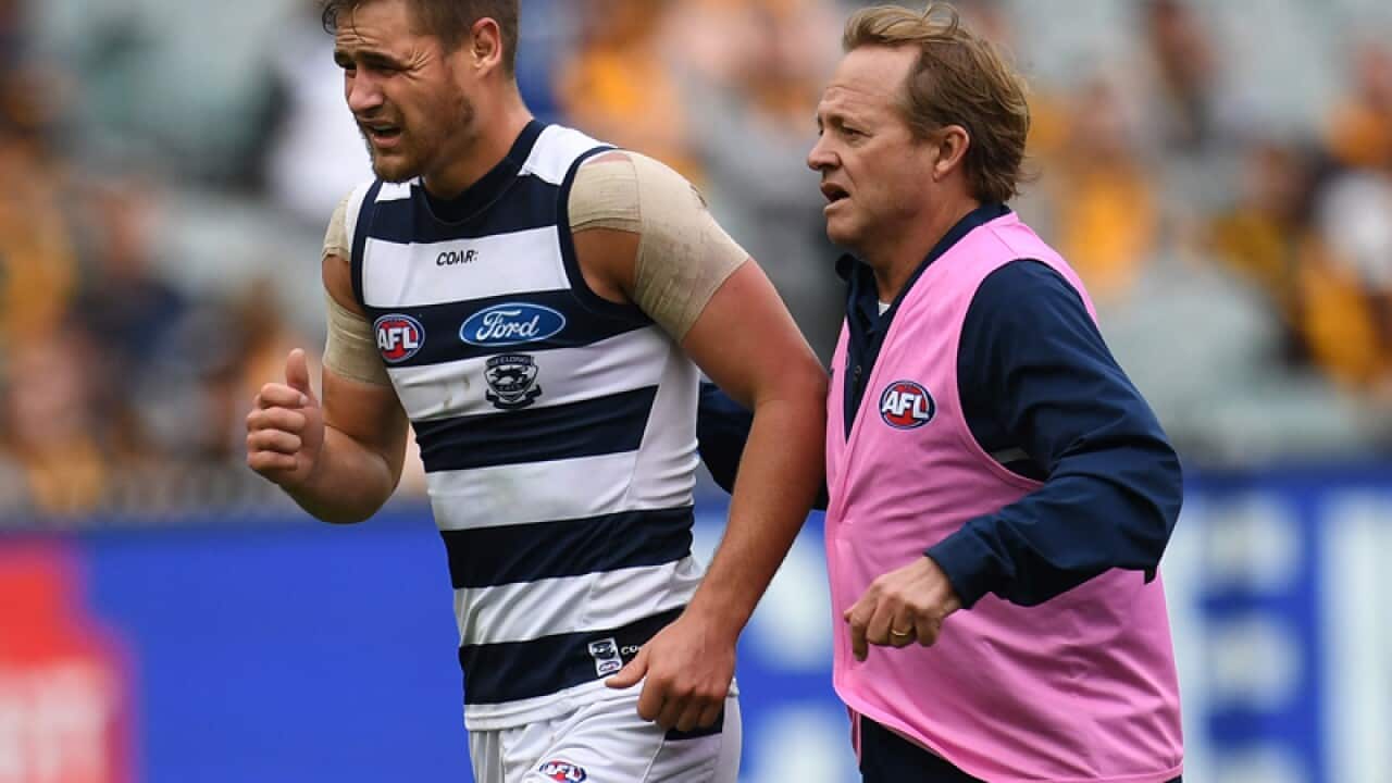 Geelong's Tom Ruggles is seen leaving the field