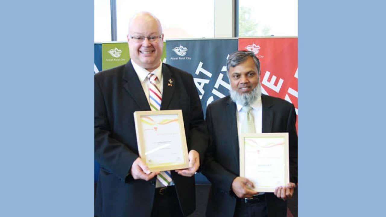 Manzoor Mian and Father Andrew Hayes