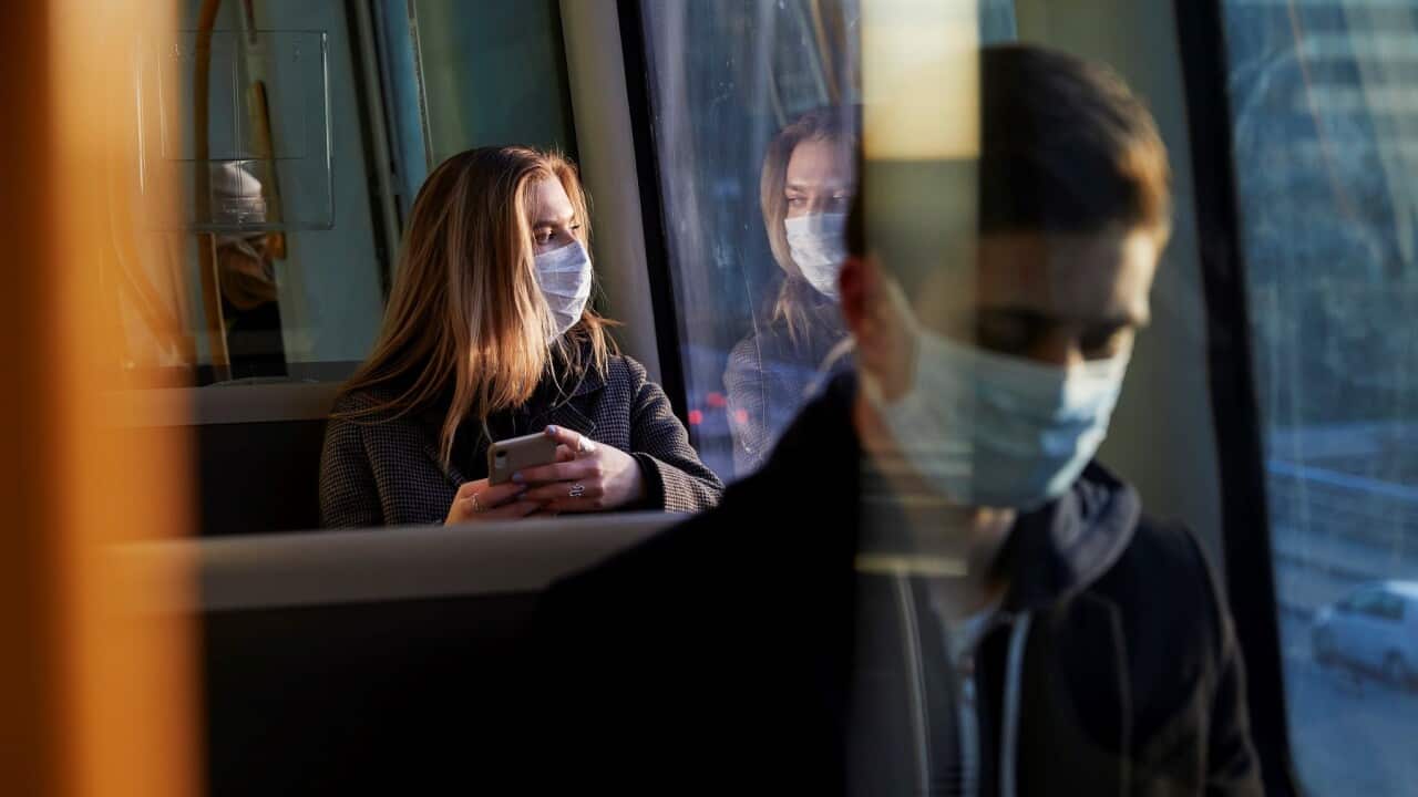 woman wearing mask in train (Getty Images)