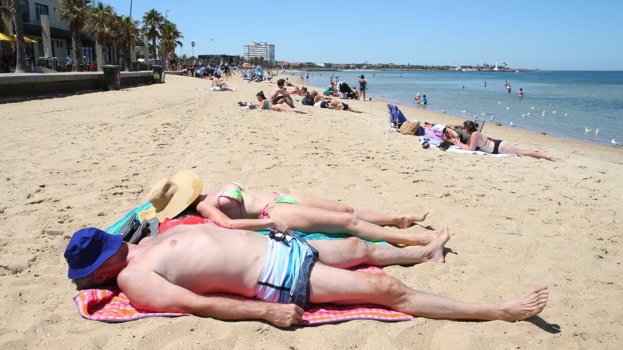 Beachgoers escape Melbourne's heat at St Kilda beach.