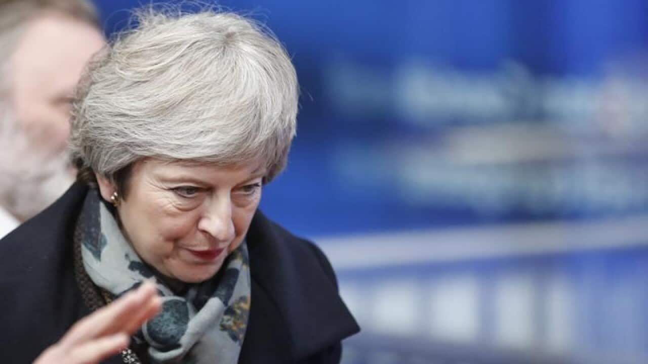 Theresa May arrives for a meeting in Brussels