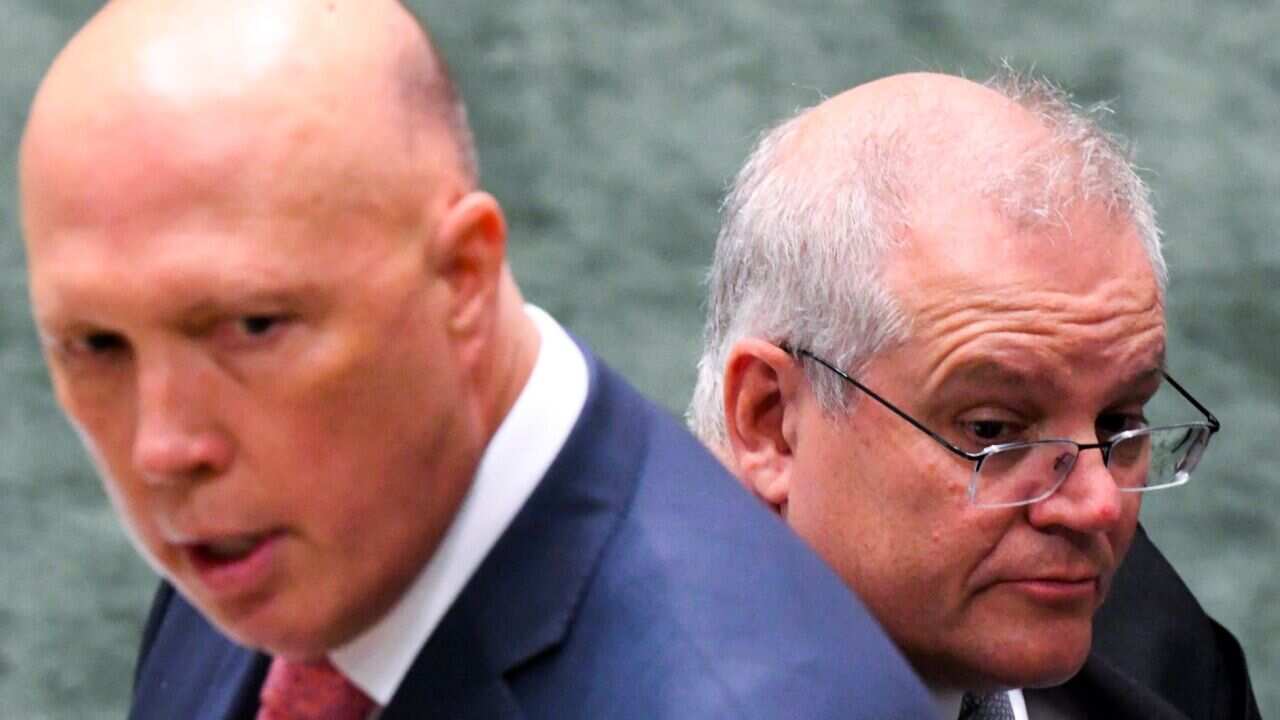 Australian Prime Minister Scott Morrison listens to the Leader of the House Peter Dutton