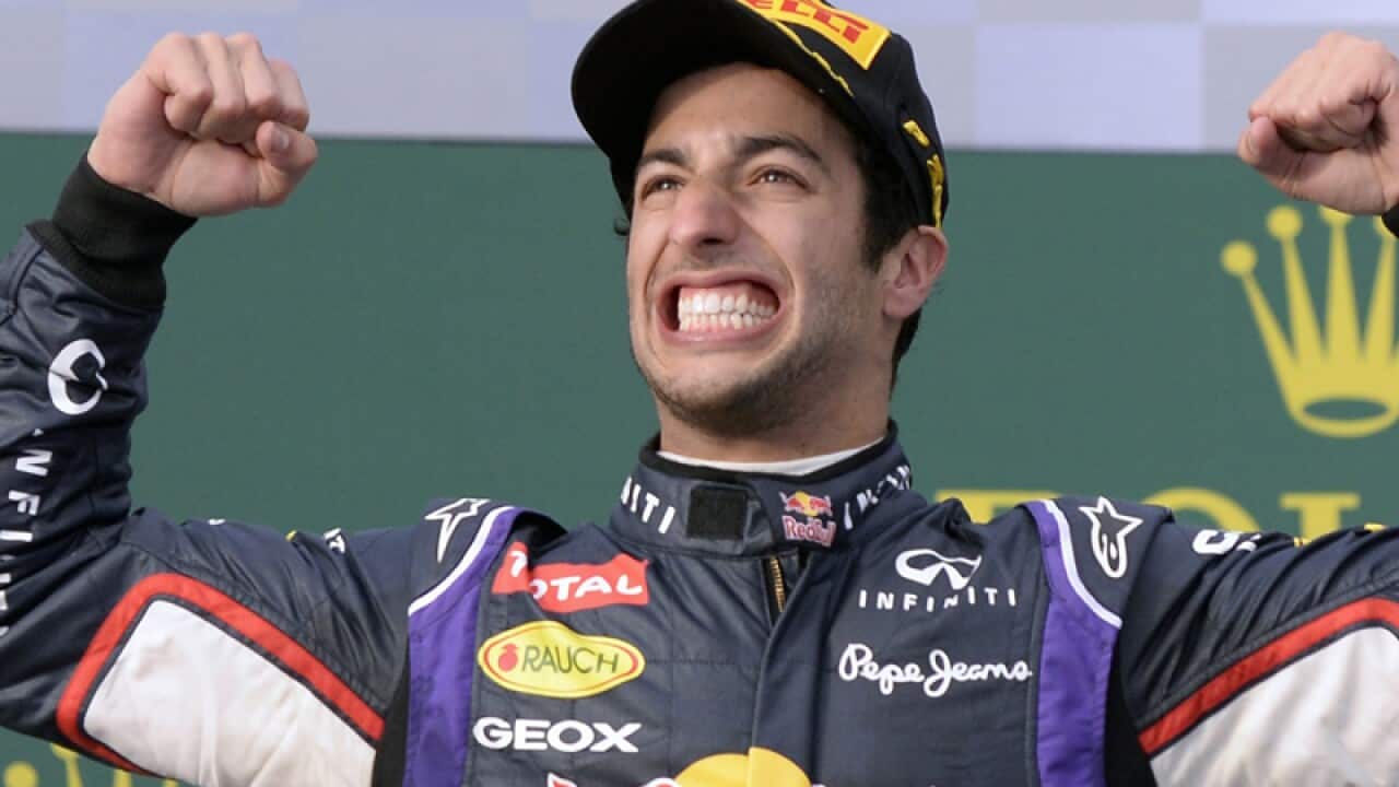 Australian driver Daniel Ricciardo reacts to taking second place.