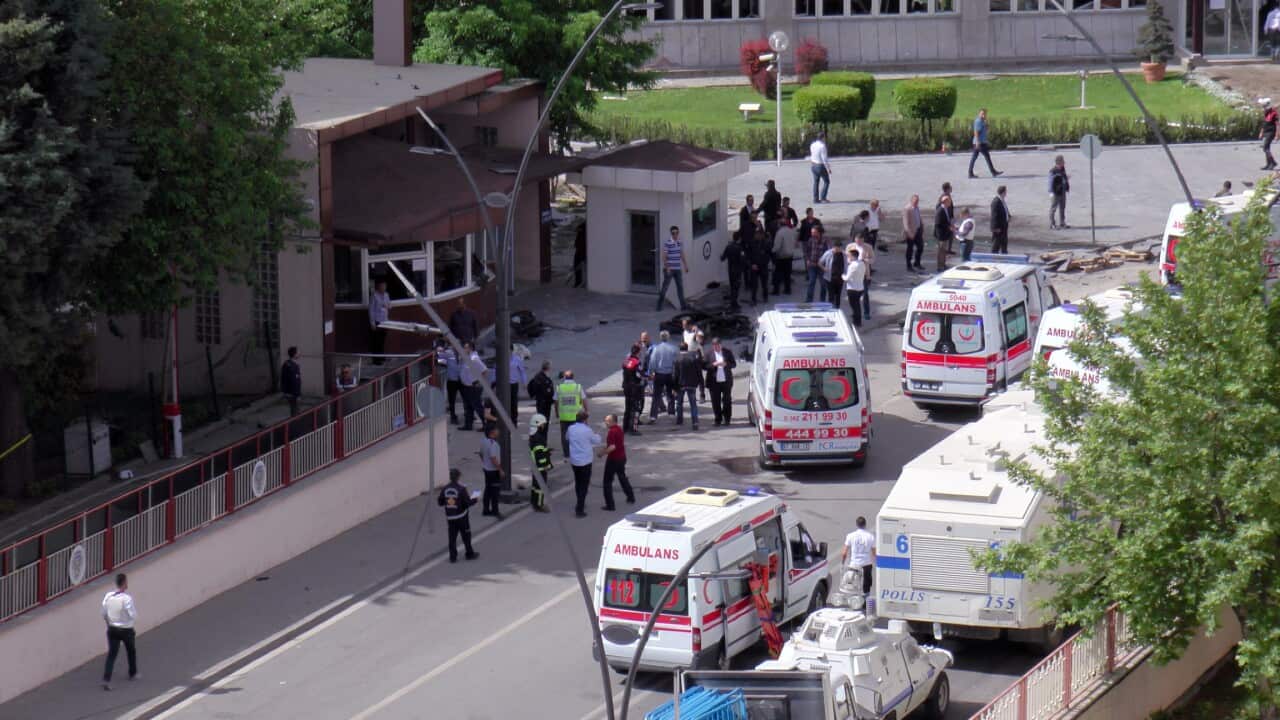 Security and forensic officials and medics investigate after an explosion outside a police station in Gaziantep, Turkey, Sunday, May 1, 2016. (AP)
