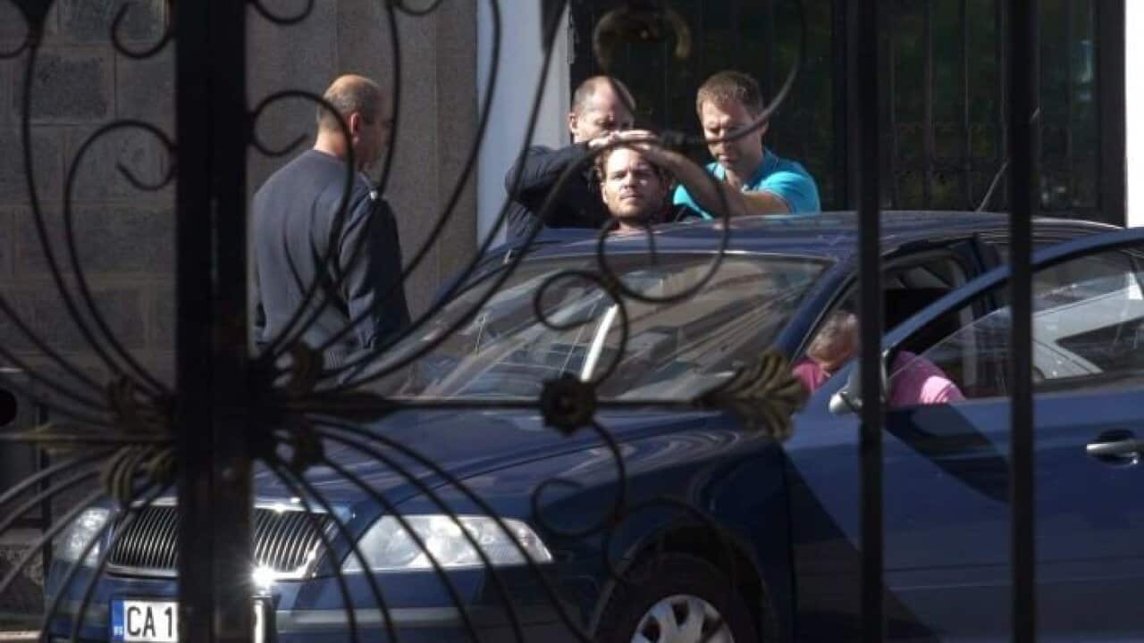 Jock Palfreeman is put into a car outside Sofia Central Prison