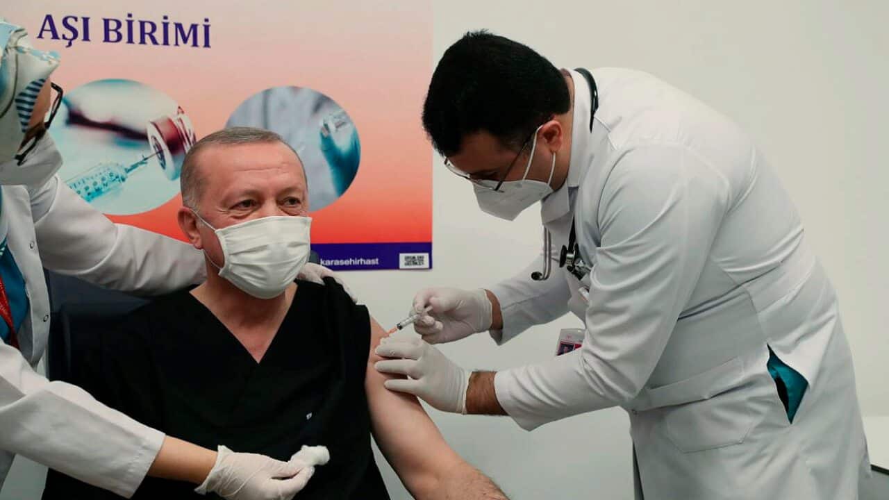 Turkey's President Recep Tayyip Erdogan receives the COVID-19 vaccination
