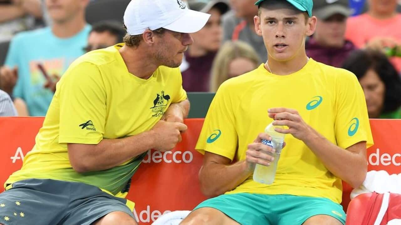 Alex de Minaur speaks with Australian Davis Cup captain Lleyton Hewitt