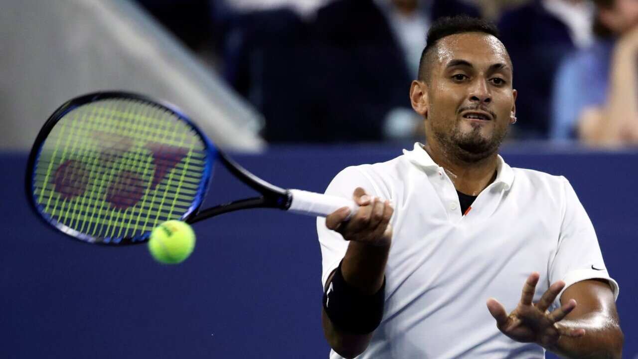 Nick Kyrgios of Australia returns to Steve Johnson of the United States