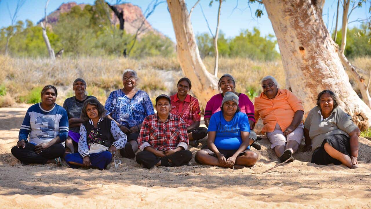 Women pose for a photo