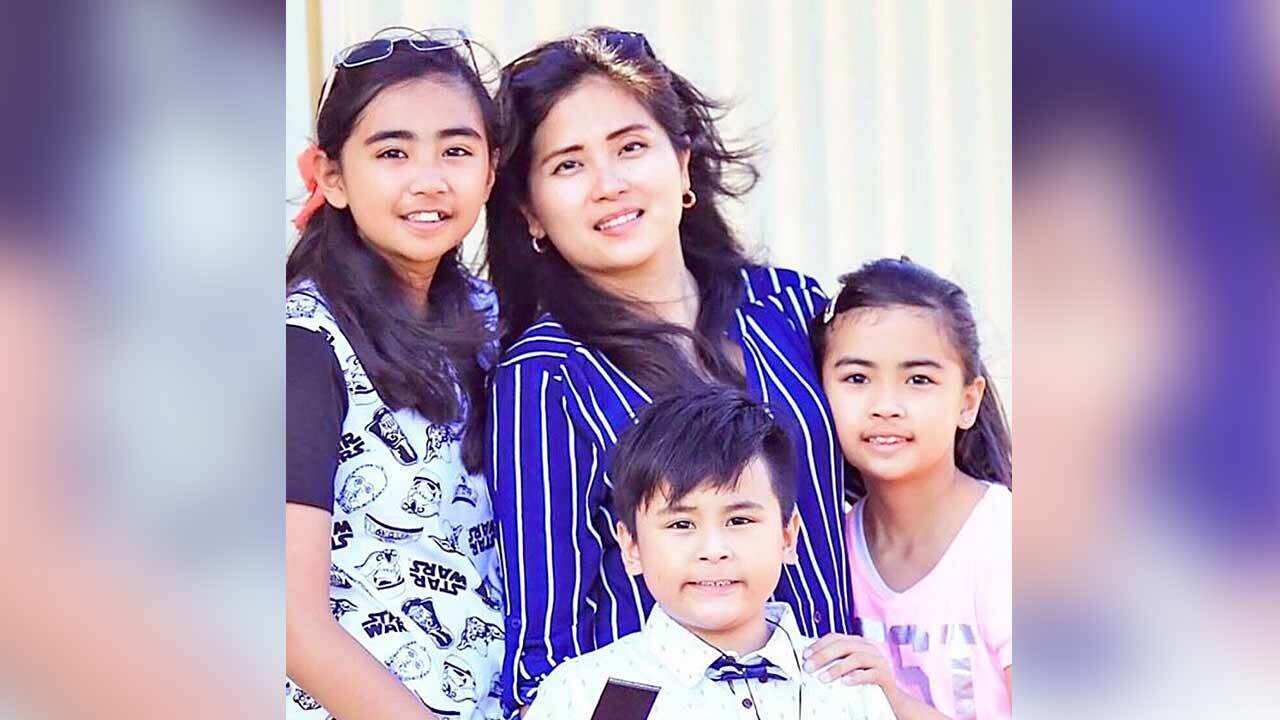 Bernadette Romulo and her children.