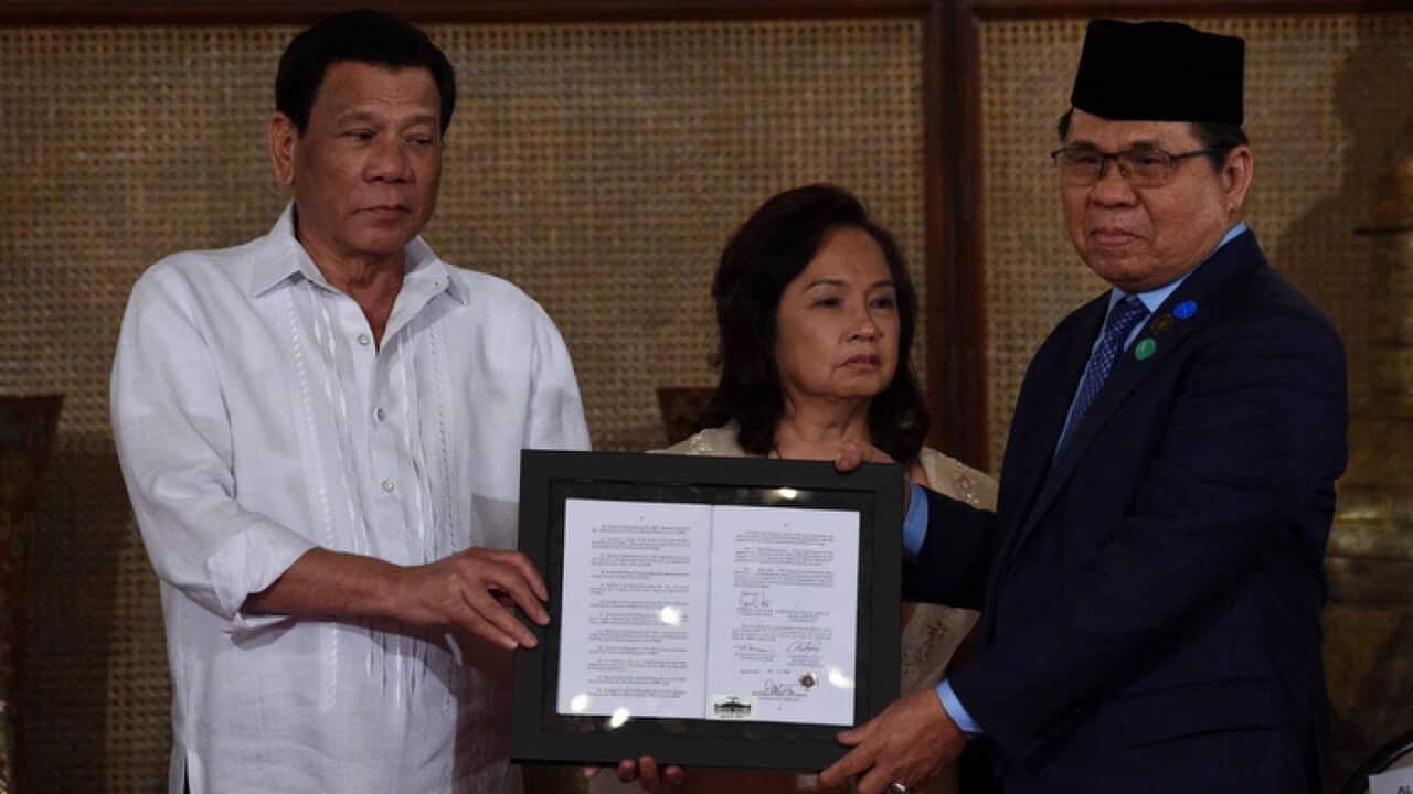President Duterte presents signed document on the Organic Law for Bangsamoro Autonomous Region of Muslim Mindanao toPhoto taken 06 August 2018.
