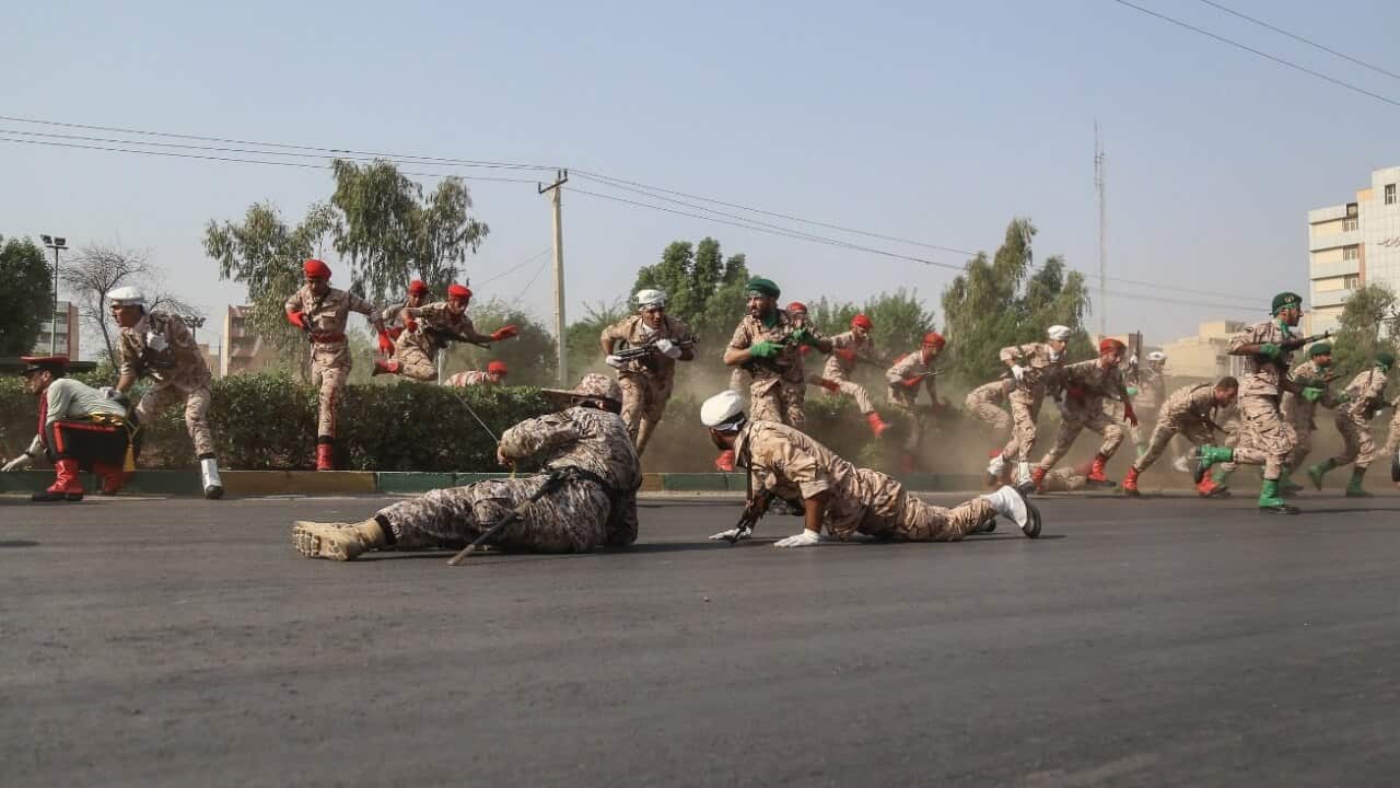 Iranian soldiers, women, and children lay down and run during a terror attack that occurred at military parade in the city of Ahvaz, southern Iran