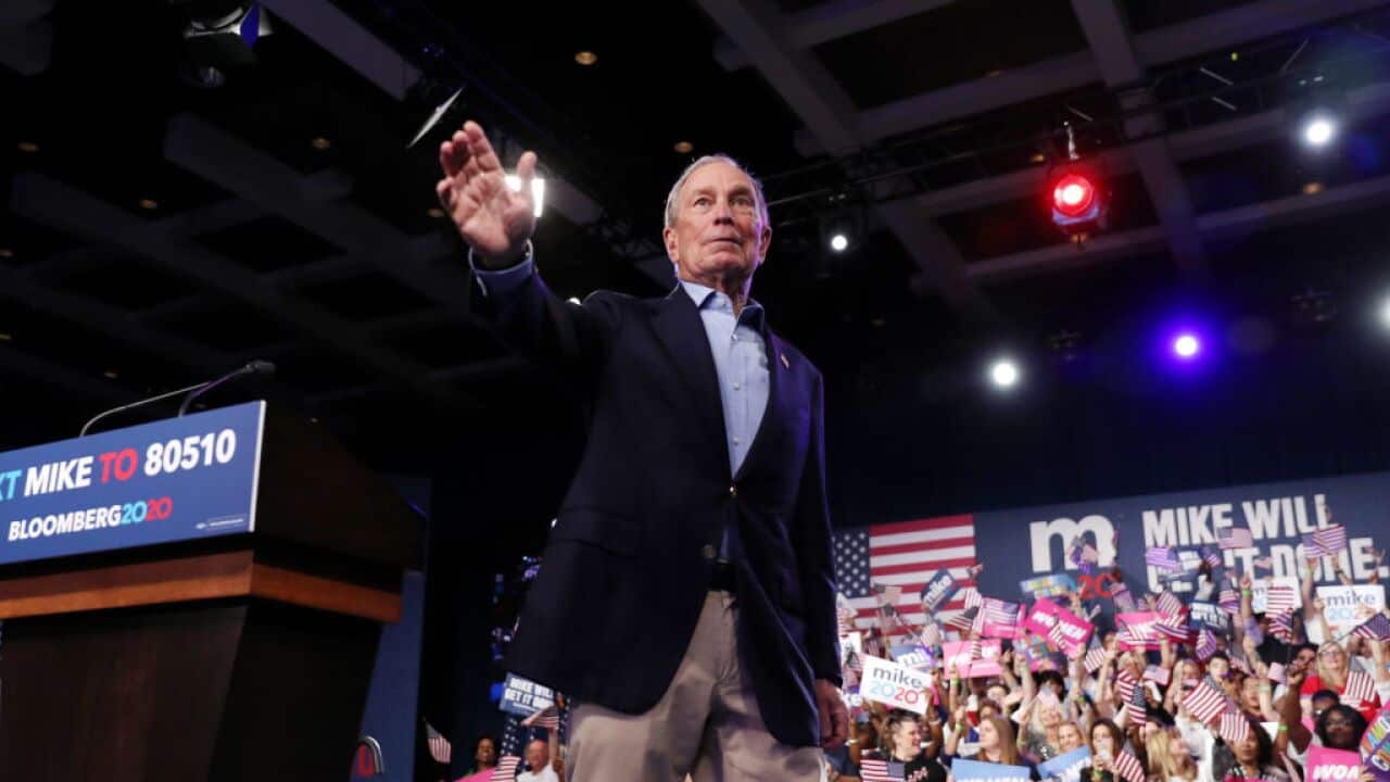 Presidential Candidate Mike Bloomberg waves to supporters in Florida.