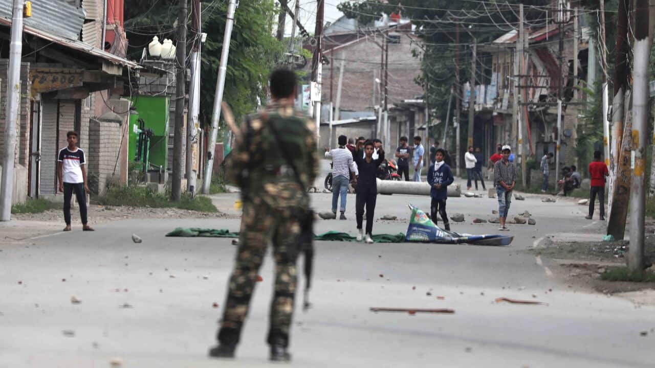 Kashmiri Muslim protester throw stones at Indian paramilitary personnel during a protest in Srinagar, India.