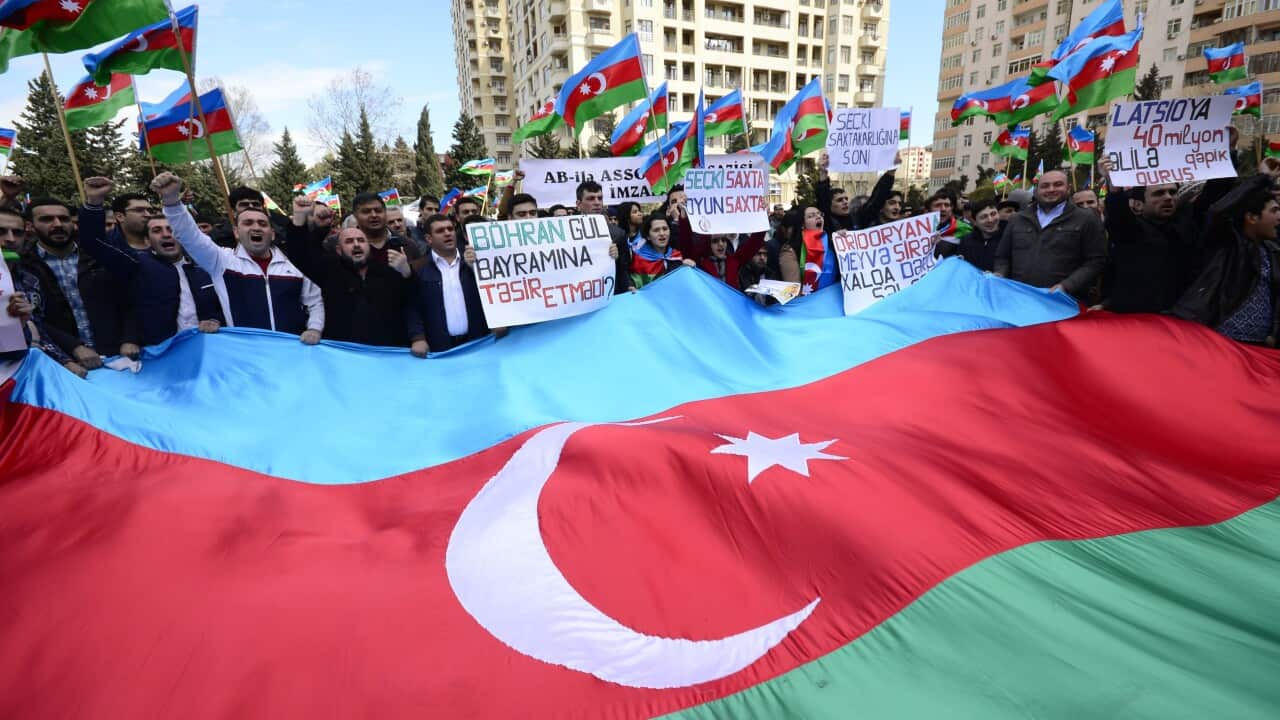 Azerbaijan opposition supporters take part in rally with the slogan "No to spendthrift and lye" in Baku on April 5, 2015. AFP PHOTO / TOFIK BABAYEV (Photo credit should read TOFIK BABAYEV/AFP/Getty Images)