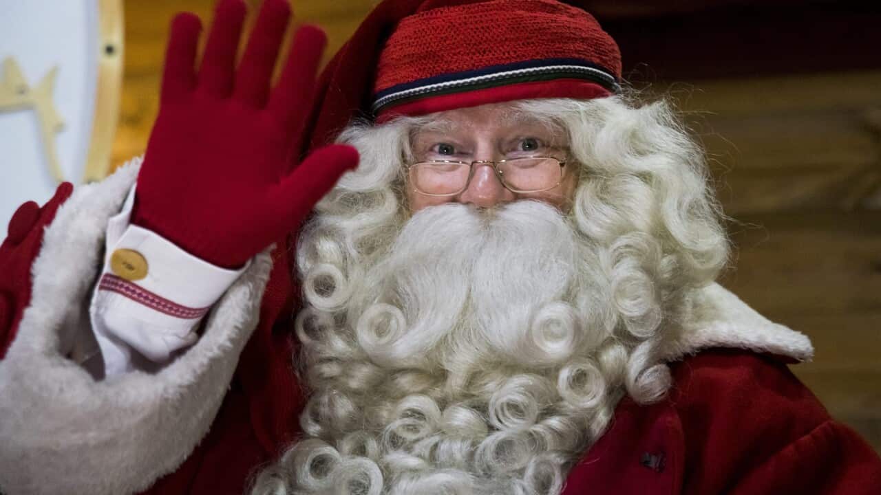 Joulupukki, the Santa Claus from Lapland in Finland, waves.