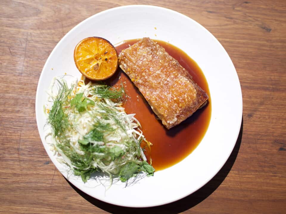 Roast pork belly with apple and brussels sprout slaw