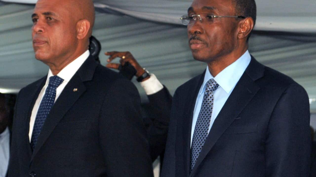 Haitian President Michel Martelly (L) and Prime Minister Evans Paul