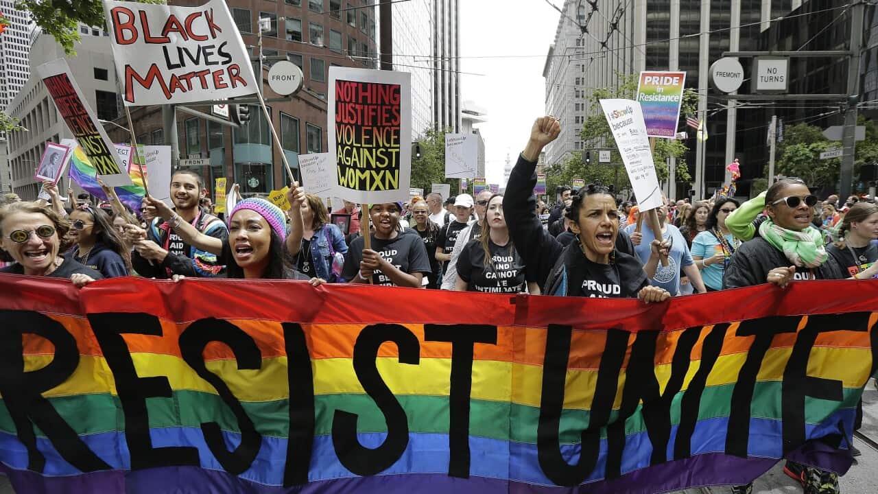 A group of marchers yell during the Pride parade in San Francisco