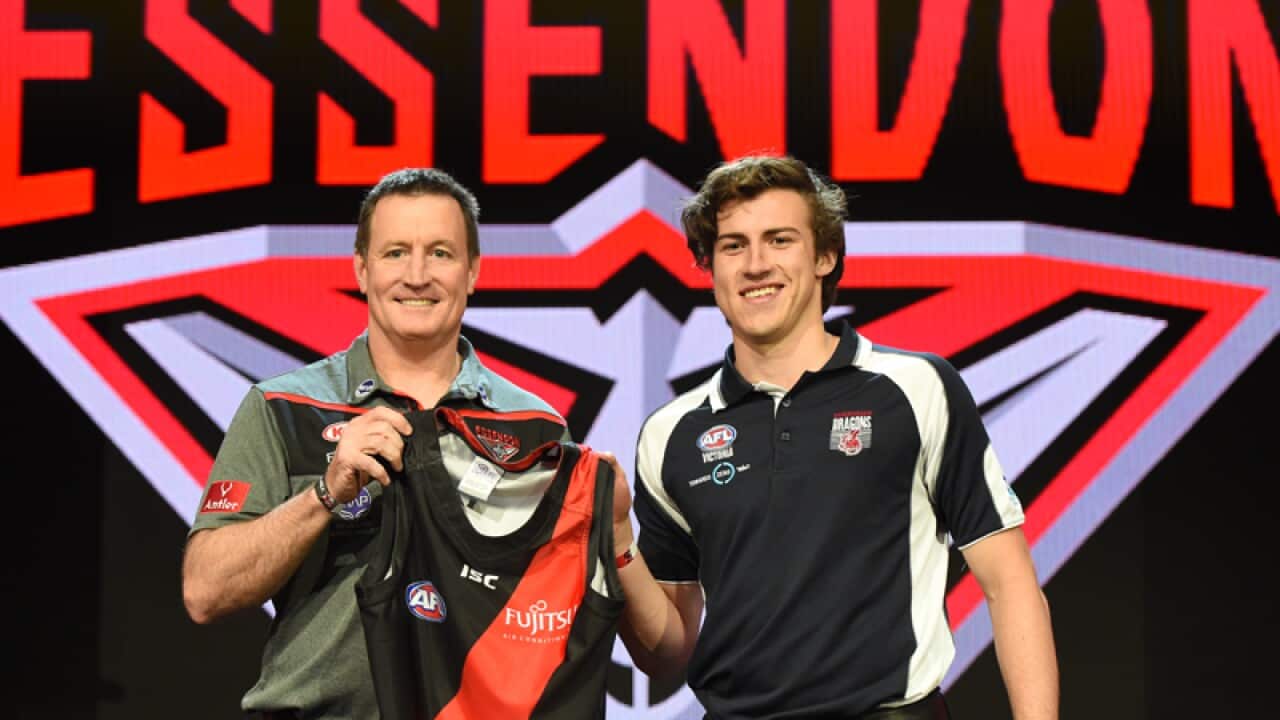 Andrew McGrath (right) with Essendon coach John Worsfold (left)