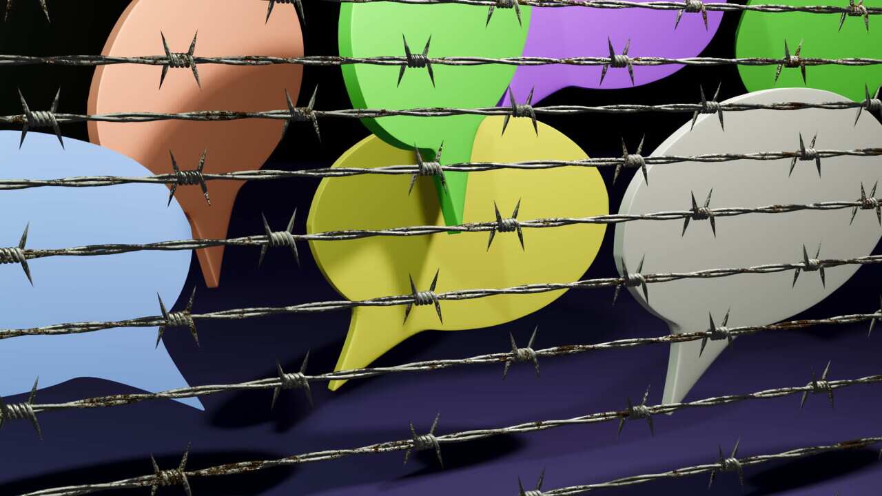 Freedom of speech - speech bubble behind barbed wire