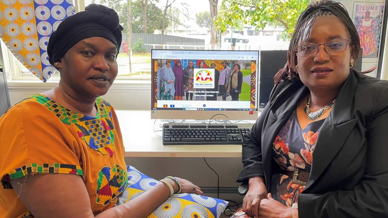 Nyaluet Yan (left) with Afri-AusCare founder Selba-Gondoza Luka. (SBS-Sandra Fulloon).jpg