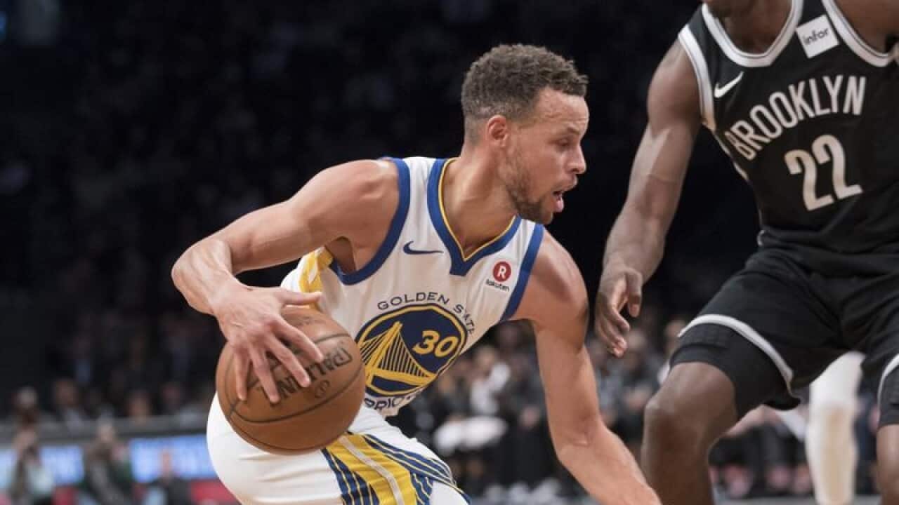 Golden State Warriors guard Stephen Curry drives to the basket
