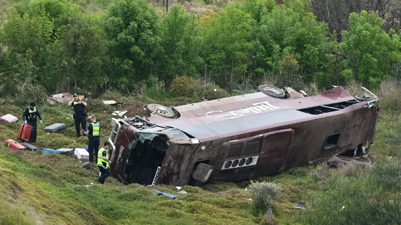 The scene of a collision between a school bus and a truck in Bacchus Marsh, Greater Melbourne, is shown.