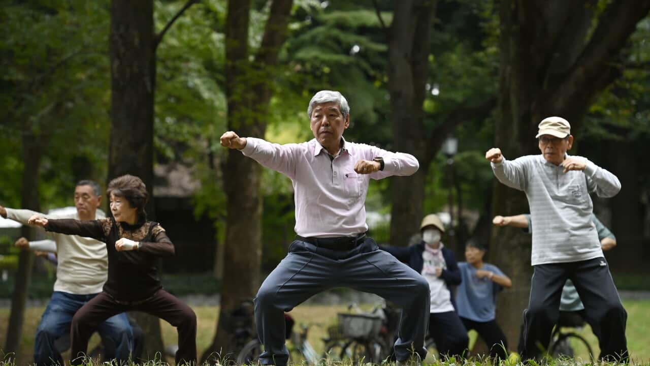 Residents exercise in a park early in the morning in Tokyo, Japan_Getty.jpg