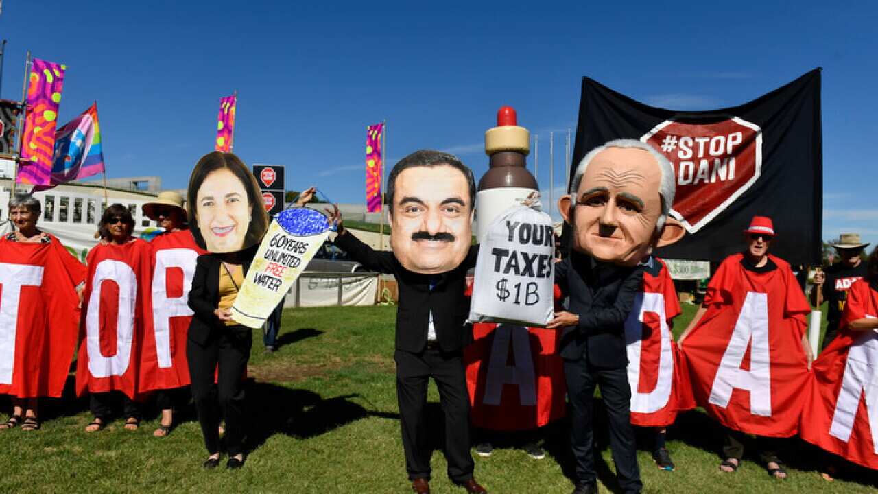 Protesters at a Stop Adani Mine rally on the lawns of Parliament House in Canberra.
