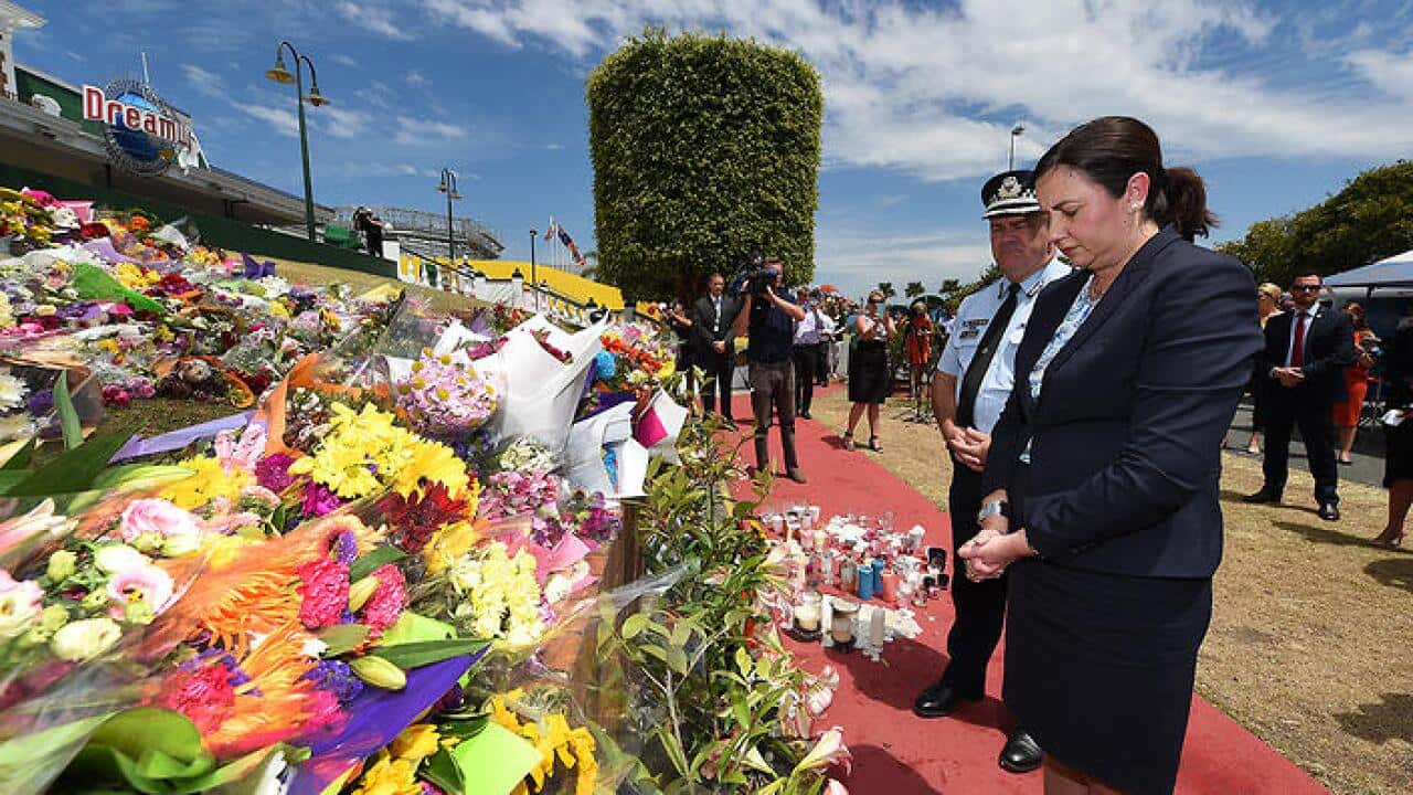 Queensland Premier Annastacia Palaszczuk pays her respects after laying a wreath outside the Dreamworld Theme Park on the Gold Coast, Thursday, Oct. 26, 2016. Four adults, two men and two women, died yesterday when the park's Thunder River Rapids ride mal