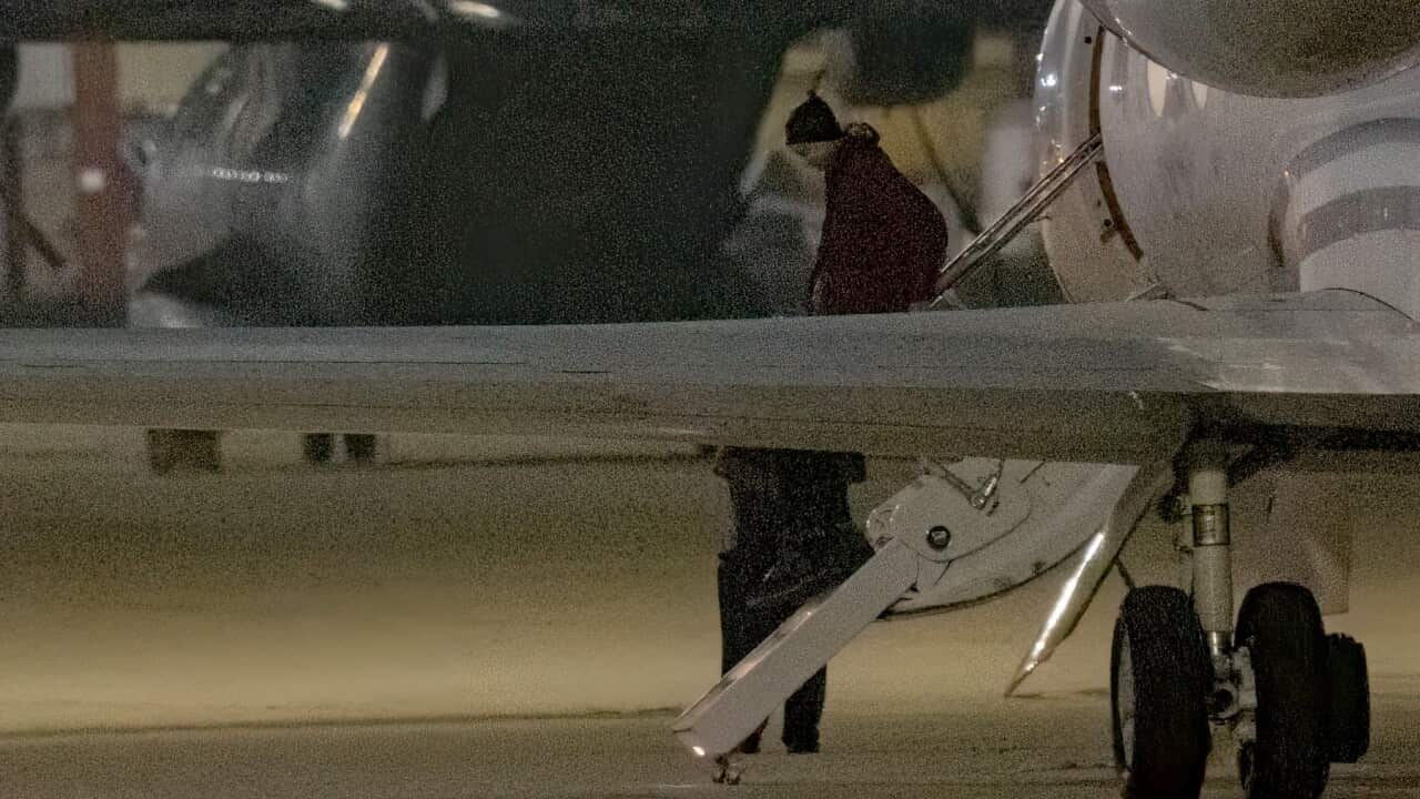 Brittney Griner gets out of a plane bringing her back from Russia