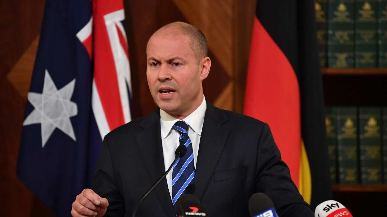 Treasurer Josh Frydenberg speaks to media during a press conference in Melbourne, 27 April 2022.