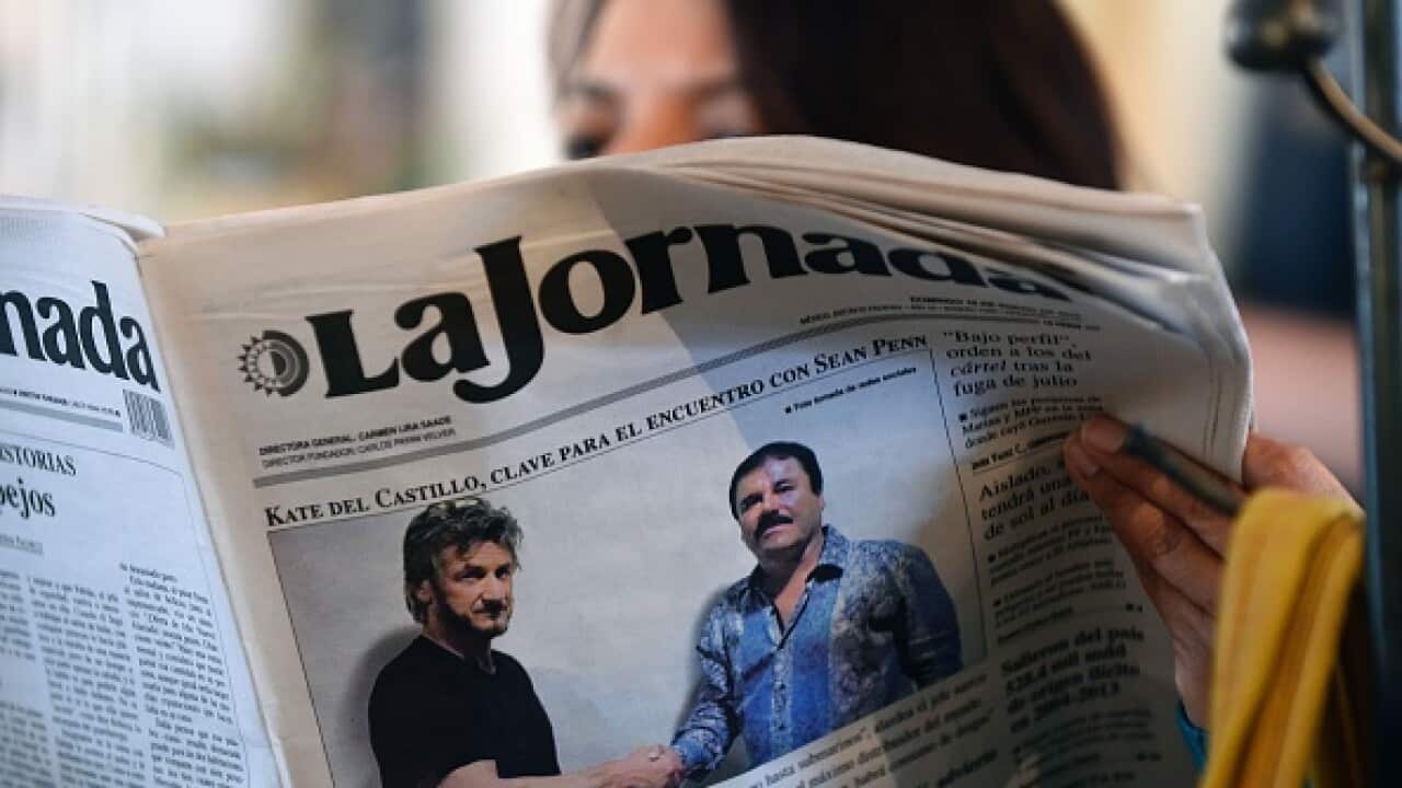 A woman reads La Jornada newspaper in Mexico City