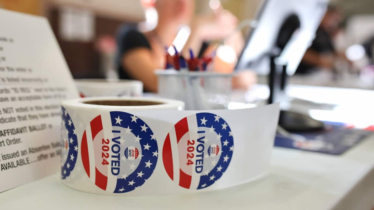 "I voted" stickers are distributed to voters, at a polling station in the Ridgewood neighborhood of Queens, New York.