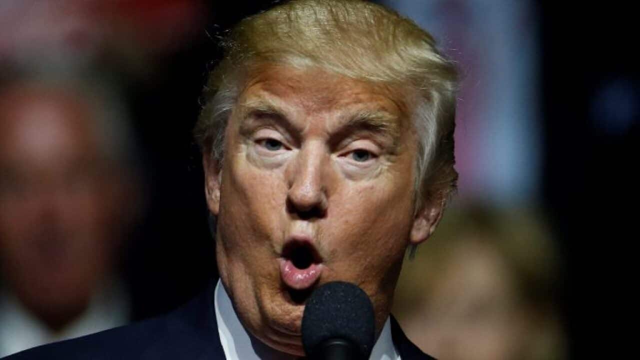 Donald Trump takes to the microphone.