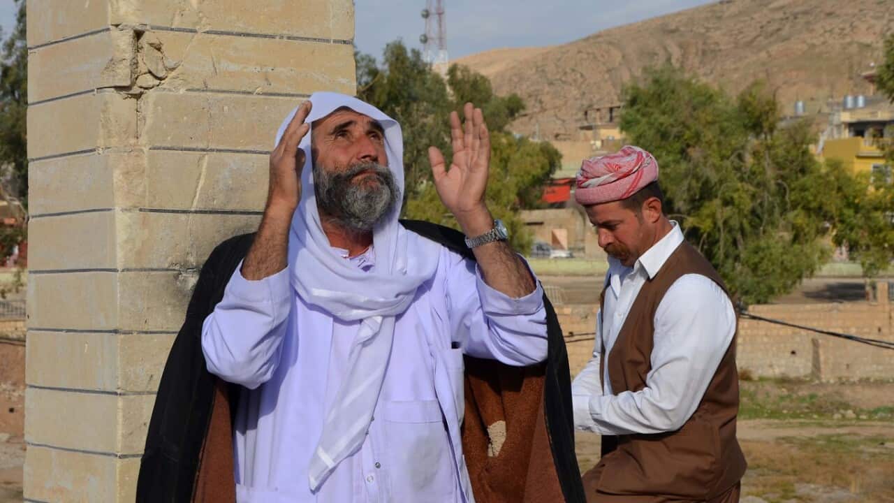 Iraqi Yazidis visit their temple during a ceremony on January 12, 2018, in the town of Bashiqa, some 20 kilometres north east of Mosul. 