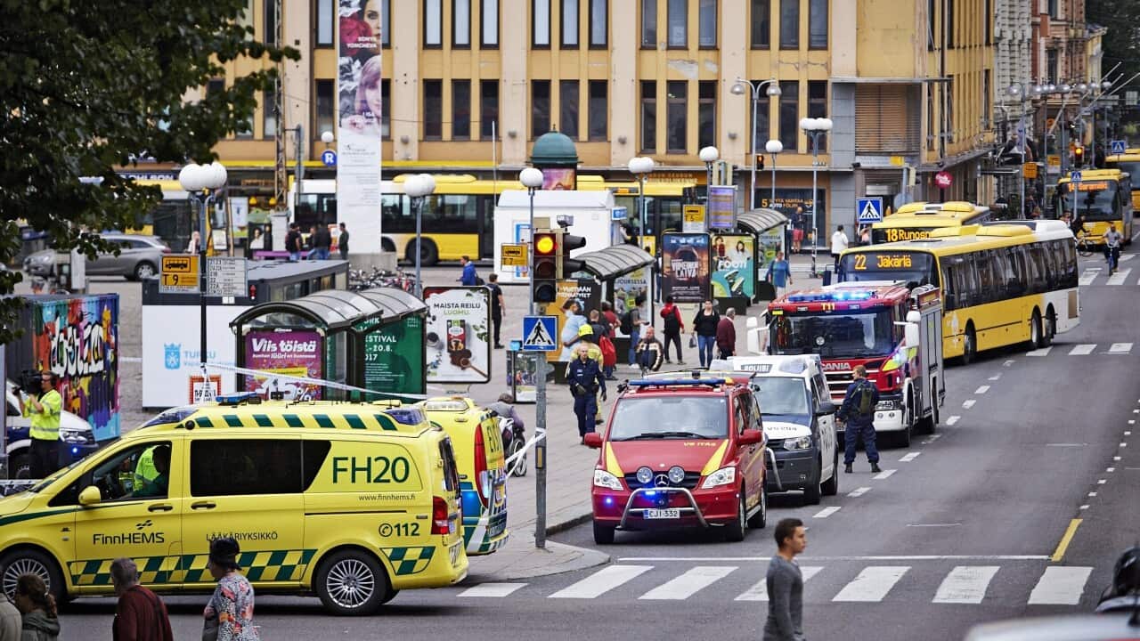 Ambulances at the site of a multiple stabbing on the Market Square in Turku, Finland.