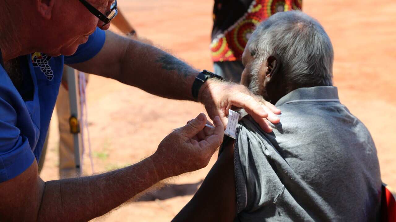 A man receives a coronavirus vaccine in the remote Aboriginal community of Beagle Bay in the Kimberley region, WA
